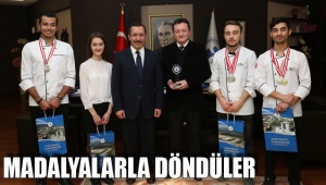 MADALYALARLA DÖNDÜLER