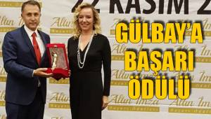 GÜLBAY’A BAŞARI ÖDÜLÜ