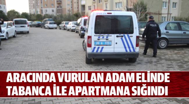 ARACINDA VURULAN ADAM ELİNDE TABANCA İLE APARTMANA SIĞINDI