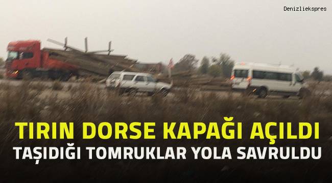Seyir halindeki otomobil tomrukların üzerine çıkarak asılı kaldı