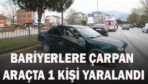 Hafriyat kamyonun dokunduğu otomobil bariyerlere çarptı: 1 yaralı
