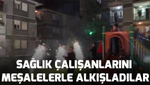 Sağlık çalışanlarına meşaleler ve alkışlarla destek verdiler