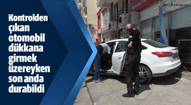 Kontrolden çıkan otomobil dükkana girmek üzereyken son anda durabildi