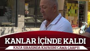 Kazada kafasını çarpan sürücünün kıyafeti kan içinde kaldı