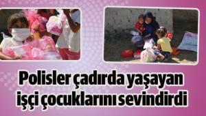 Polisler çadırda yaşayan işçi çocuklarını sevindirdi