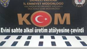 Evini sahte alkol üretim atölyesine çevirdi