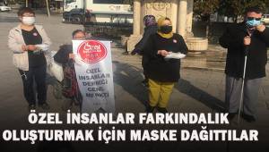 Özel insanlar farkındalık yaratmak için maske dağıttılar