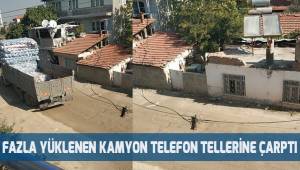 Fazla yüklenen kamyon telefon tellerine çarptı