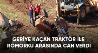 Geriye kaçan traktör ile römorku arasında can verdi