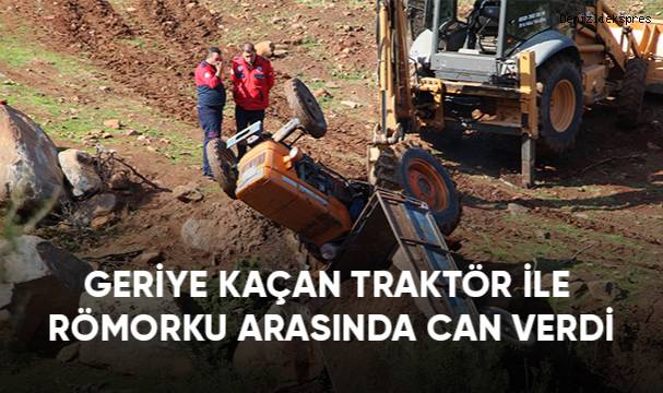 Geriye kaçan traktör ile römorku arasında can verdi