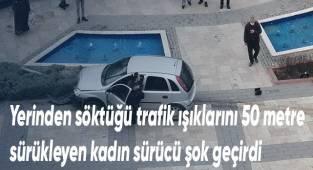 Kadın sürücü trafik ışıklarını söküp götürdü