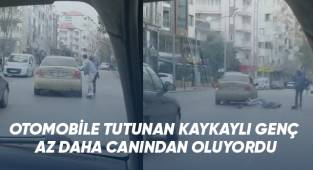 Otomobile tutunan kaykaylı genç az daha canından oluyordu