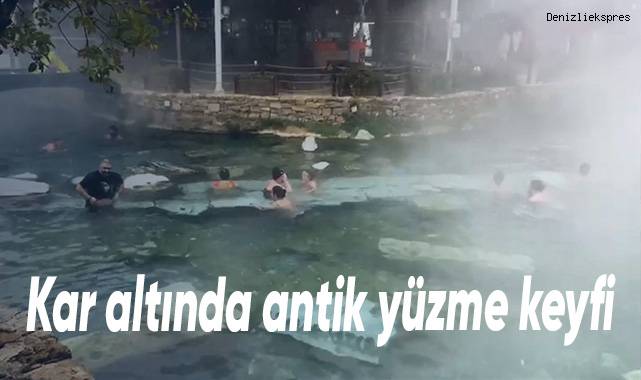 Termal havuza giren turistler, kar altında yüzmenin keyfini çıkardı