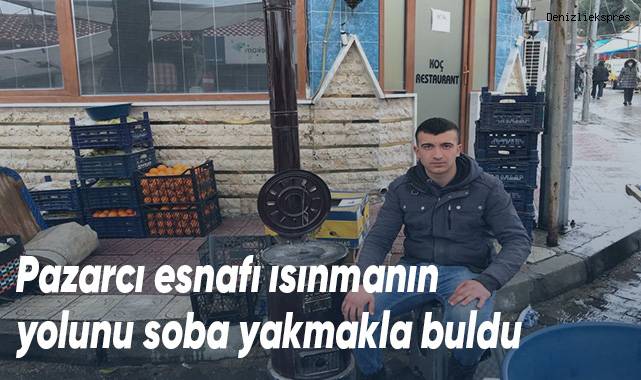 Pazarcı esnafı ısınmanın yolunu soba yakmakla buldu
