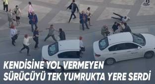 Kendisine yol vermeyen sürücüyü tek yumrukta yere serdi
