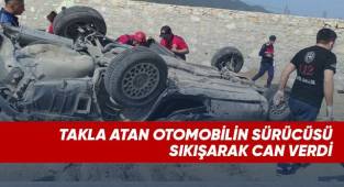 Takla atan otomobilin sürücüsü sıkışarak can verdi