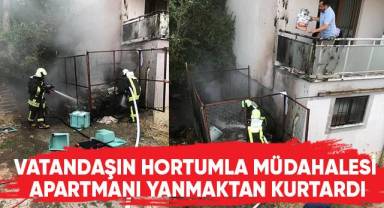 Vatandaşın hortumla müdahalesi apartmanı yanmaktan kurtardı