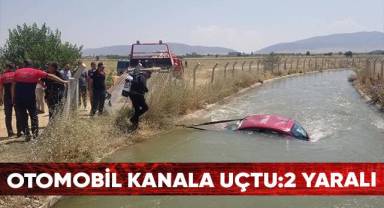 Sulama kanalına uçan otomobilden yaralı kurtuldular