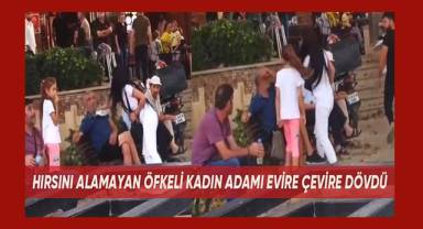 Hırsını alamayan öfkeli kadın bir adamı evire çevire dövdü