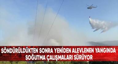 Söndürüldükten sonra yeniden alevlenen yangında soğutma çalışmaları sürüyor