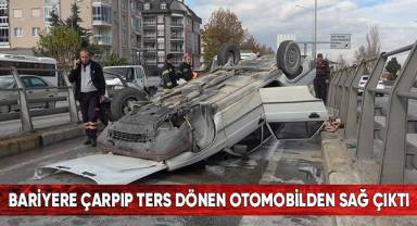 Bariyere çarpıp ters dönen otomobilden sağ çıktı