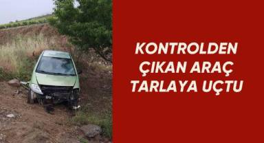 Kayganlaşan yolda kontrolden çıkan otomobil tarlaya uçtu