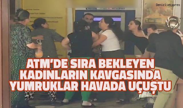Ringe dönüşen ATM'deki kavgaya aldırış etmeden parasını çekmeye devam etti