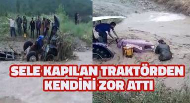 Sele kapılan traktörü kurtarmak isterken az daha canından oluyordu