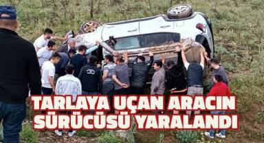 Karşı şeride geçip tarlaya uçan aracın sürücüsü yaralandı