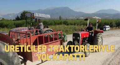 Tehlikeli geçidi kullanmak istemeyen üreticiler, yolu kapatarak tepki gösterdi