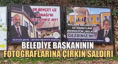 Başkanın fotoğrafına sprey boya ile bıyık ve peruk çizdiler