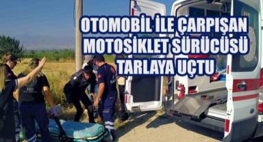 Otomobil ile çarpışan motosiklet sürücüsü tarlaya uçtu