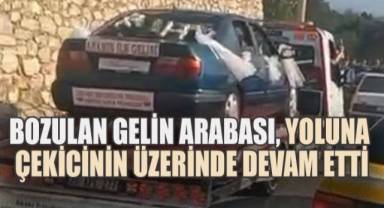 Bozulan gelin arabası yoluna çekicinin üzerinde devam etti