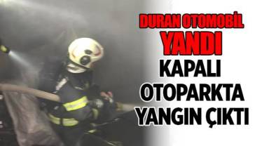 Kapalı otoparkta duran otomobile alevler sarsı